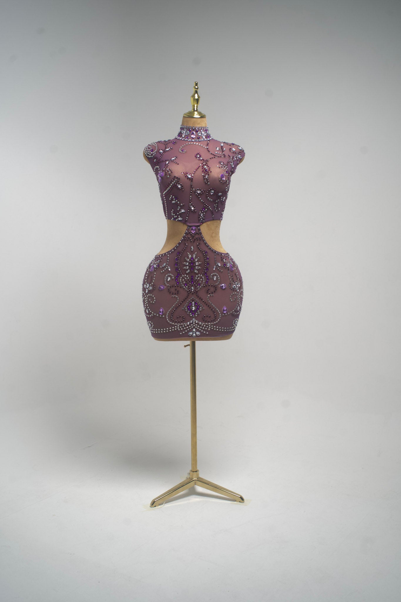 A  from allure purple embellished bustier top displayed on a gold dress form mannequin against a light gray studio background.