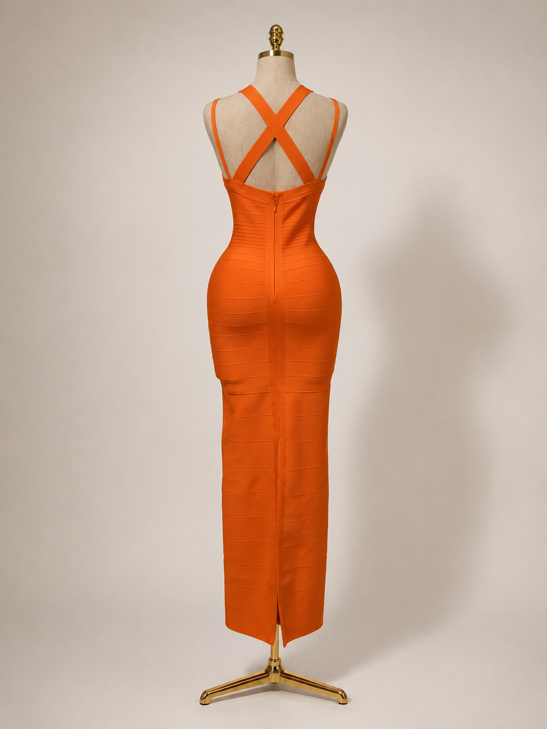 from allure Orange dress on a mannequin against a plain background